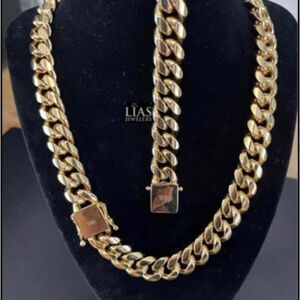 New 18k yellow gold Cuban link chain and bracelet set